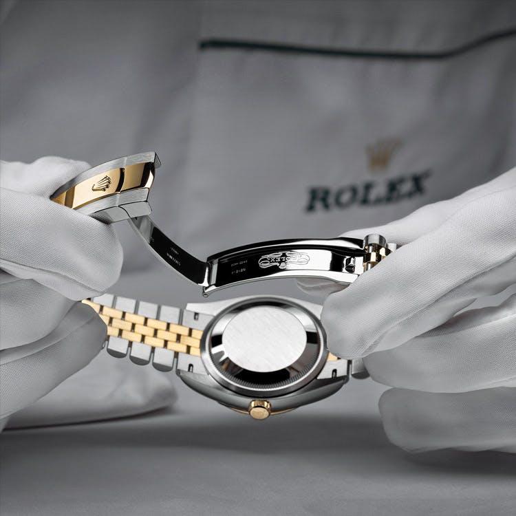 serving a Rolex watch at Lee Michaels Fine Jewelry stores