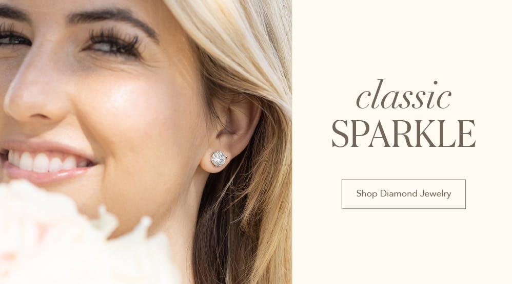 smiling woman with a diamond earring next to the words classic sparkle shop diamond jewelry