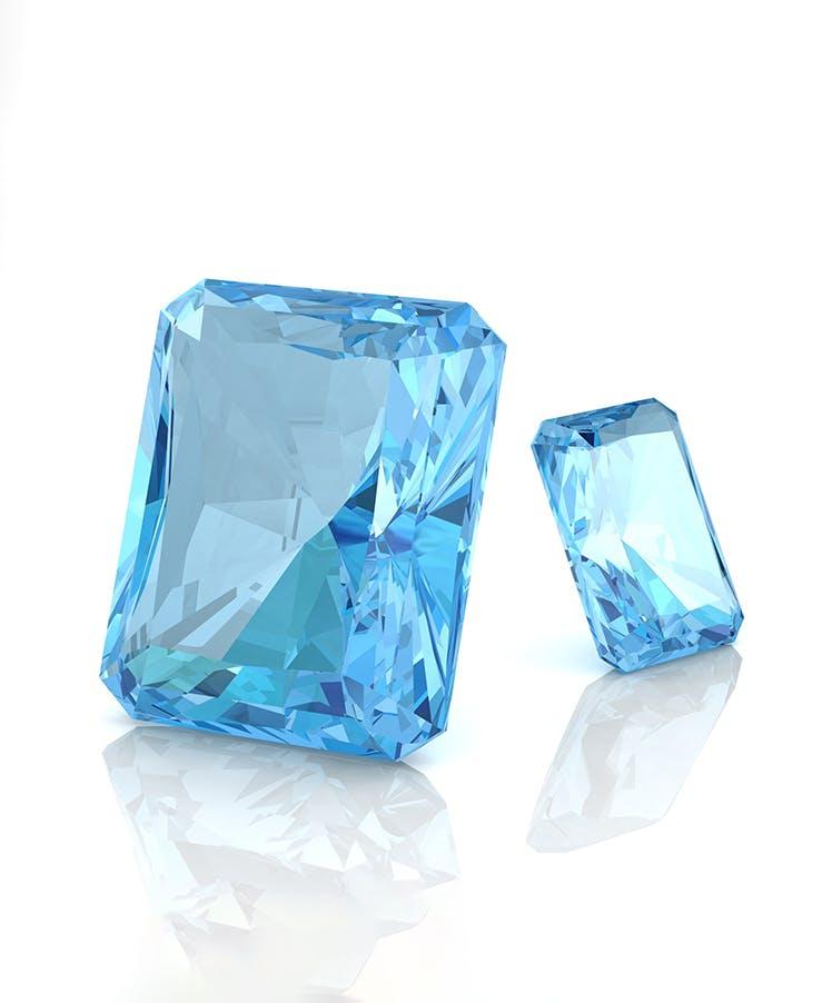 two loose aquamarine gemstones