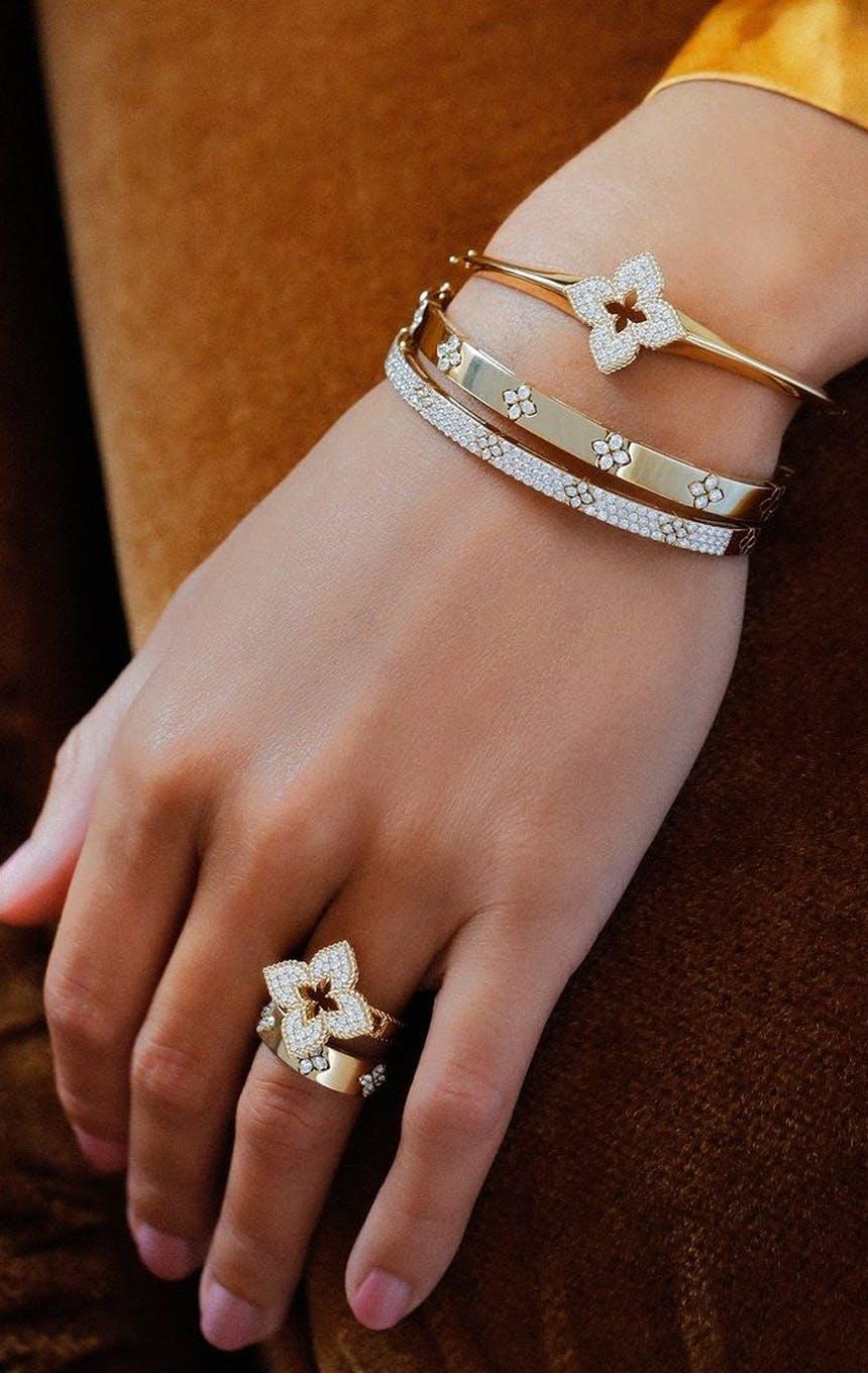 Photo of a hand and wrist modeling Roberto Coin jewelry