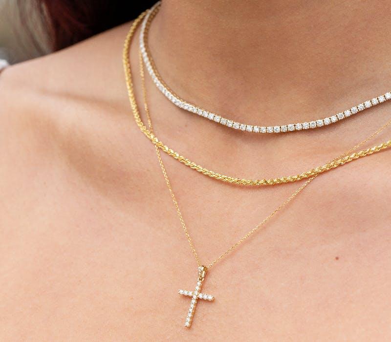 diamond cross necklace at Lee Michaels Fine Jewelry