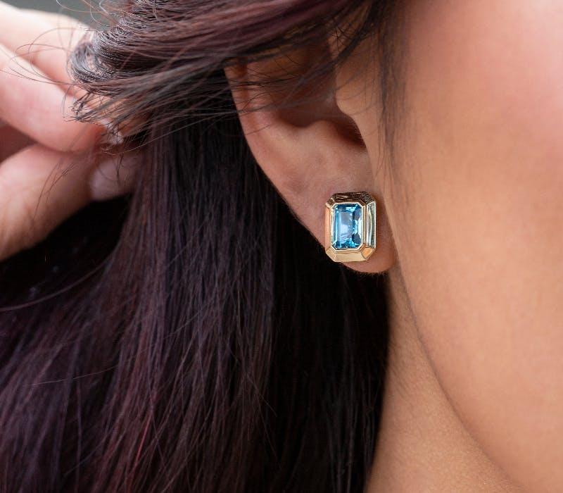 blue topaz colored earrings, available at Lee Michaels Fine Jewelry stores